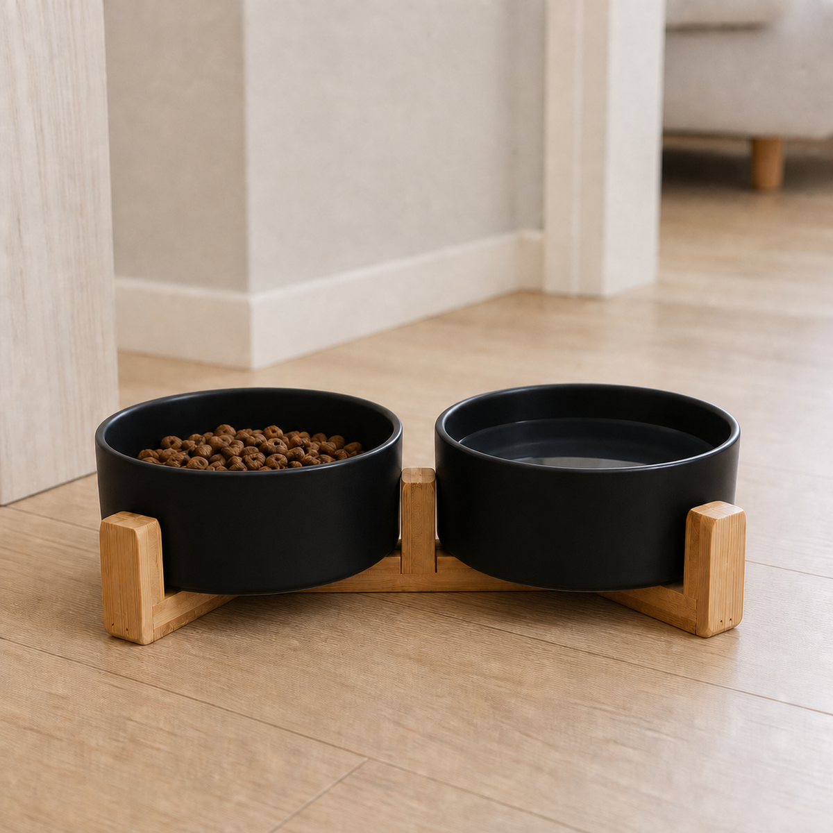 Black Dine ceramic cat bowls on a bamboo stand with kibble and water